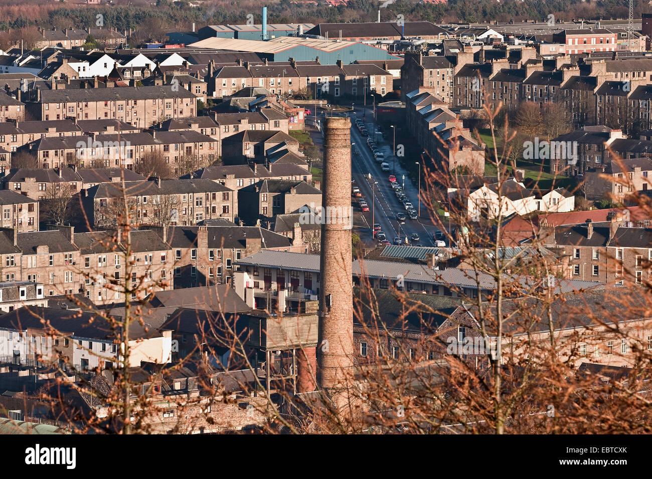 Early Winter landscape view of 1800`s jute mill chimney and tenement housing from “The Law” Cenotaph in Dundee, UK Stock Photo
